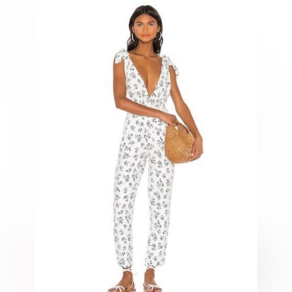 LPA white with black flower Jumpsuit. v neck front and back and tie shoulder